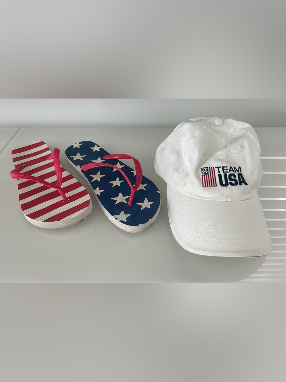 Team USA White new Baseball Cap & Flip
flops.